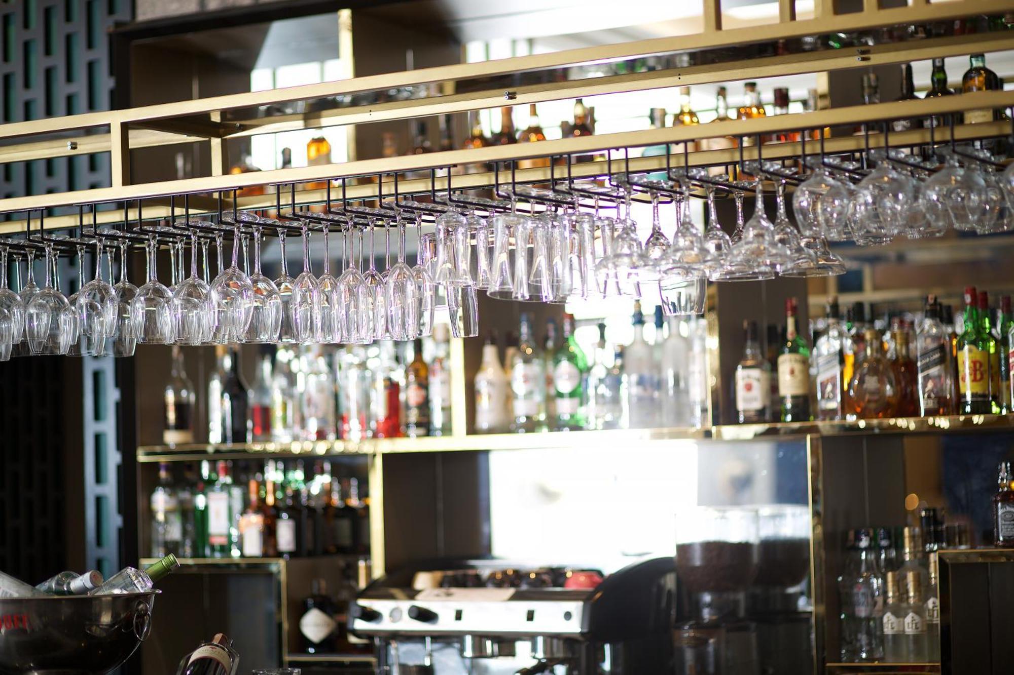 Ramada By Wyndham Istanbul Merter Exterior foto Wine glasses hanging above a bar
